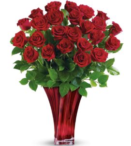 Red roses in stunning red glass art vase