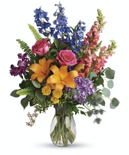 Color any occasion beautiful with this lovely bouquet of hydrangea, roses and lilies in all the colors of the rainbow.