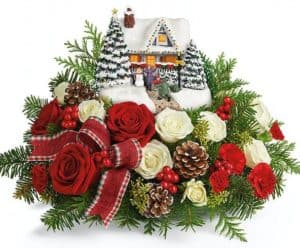 Thomas Kinkade collectible with light-up windows and hand-painted details.This arrangement includes red roses, miniature white roses, white button spray chrysanthemums